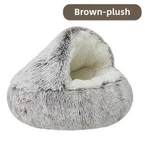 Gray plush pet bed with white interior on a white background